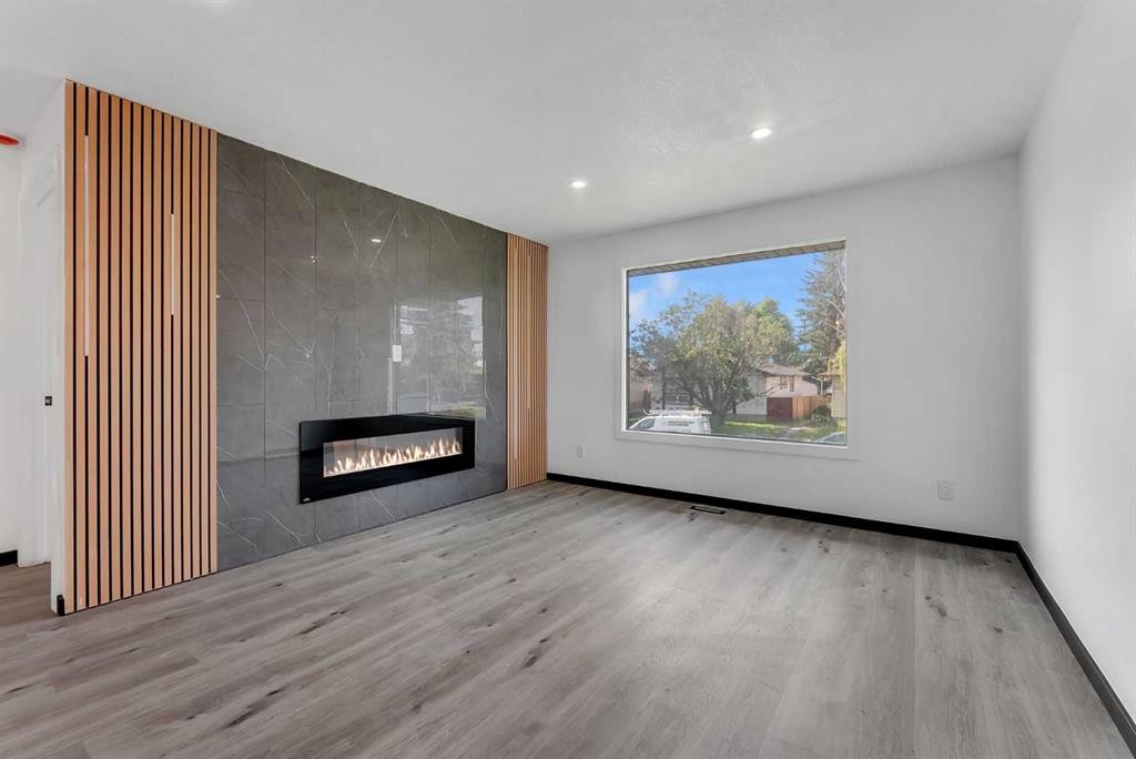 4108 13 Avenue Ne, Calgary, AB - Indoor Photo Showing Living Room With Fireplace