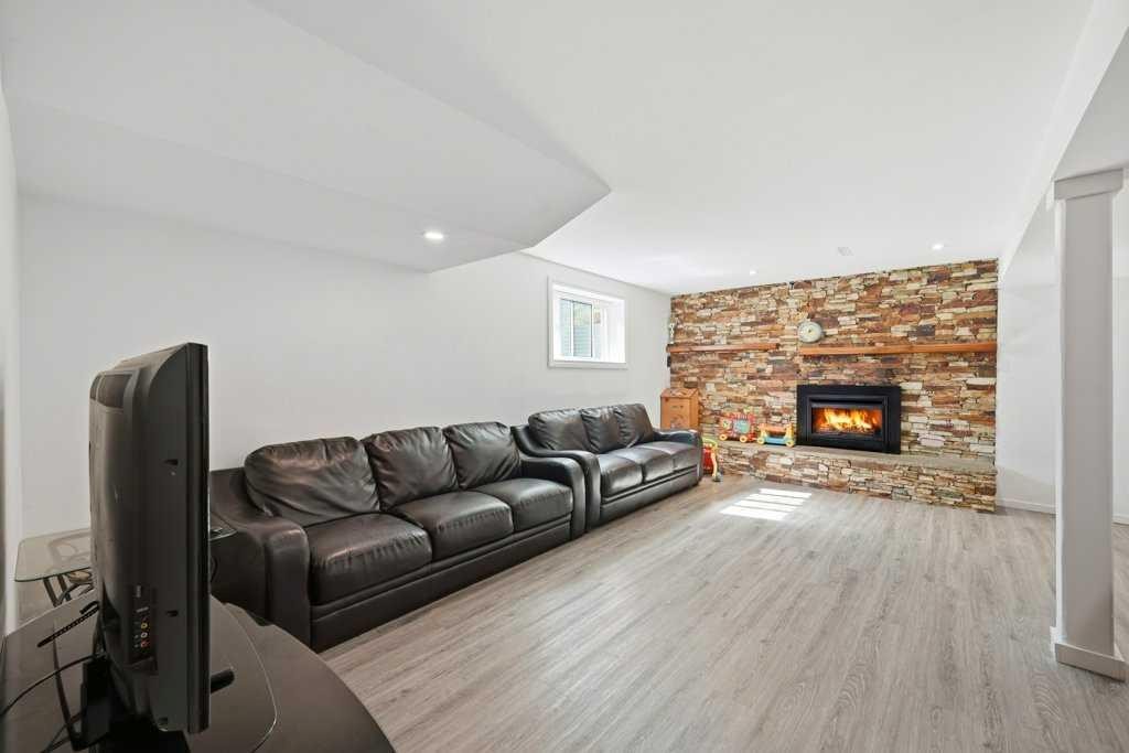 2415 Vista Crescent Ne, Calgary, AB - Indoor Photo Showing Living Room With Fireplace