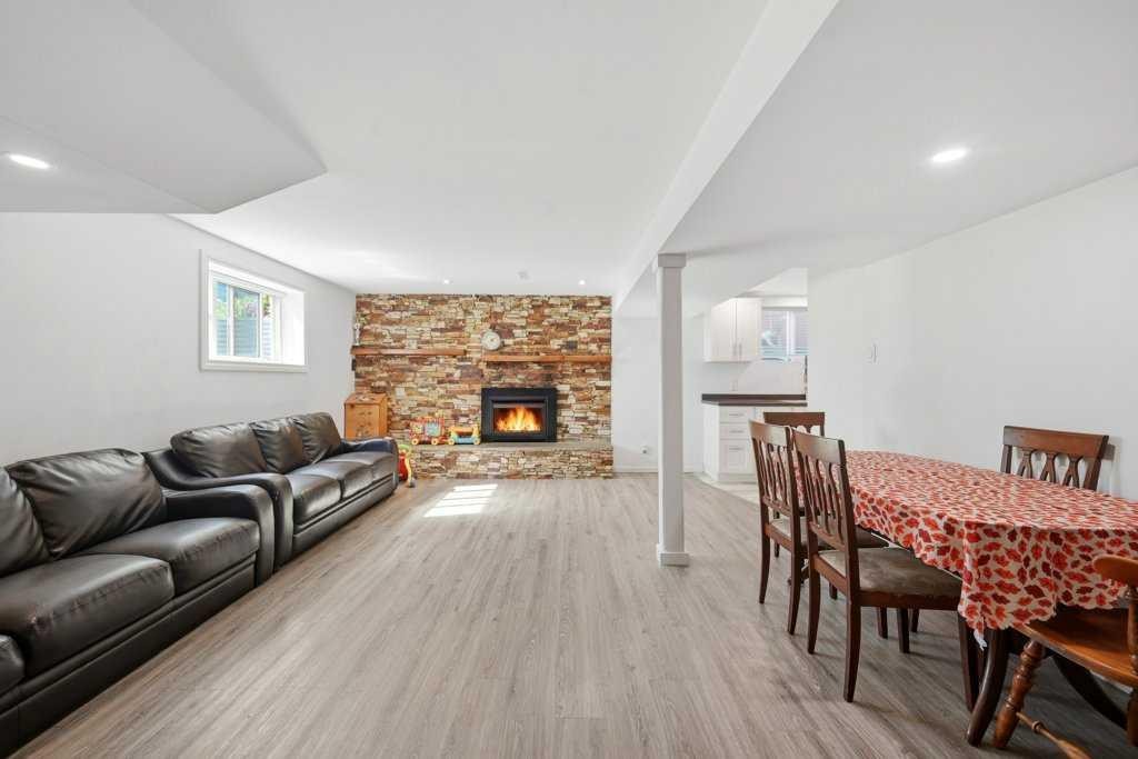 2415 Vista Crescent Ne, Calgary, AB - Indoor Photo Showing Living Room With Fireplace