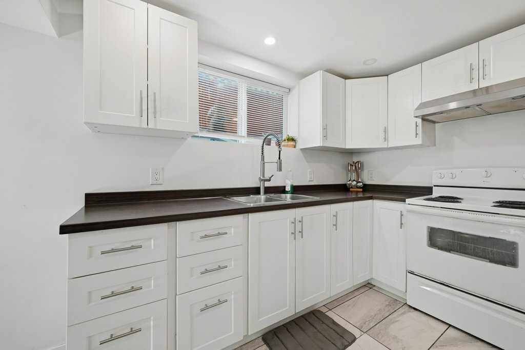 2415 Vista Crescent Ne, Calgary, AB - Indoor Photo Showing Kitchen With Double Sink