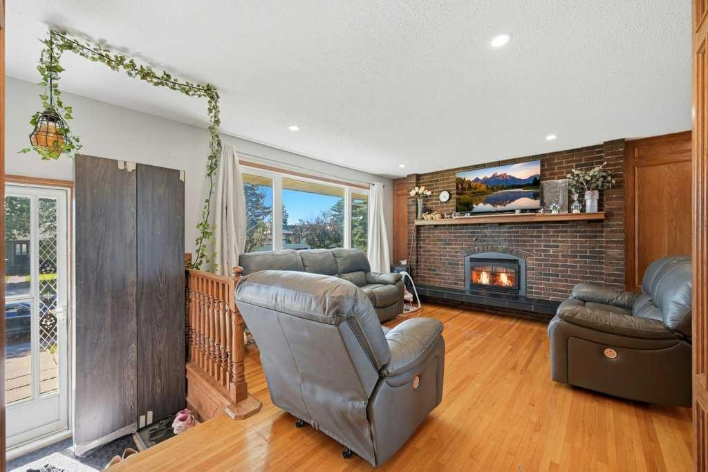 2415 Vista Crescent Ne, Calgary, AB - Indoor Photo Showing Living Room With Fireplace
