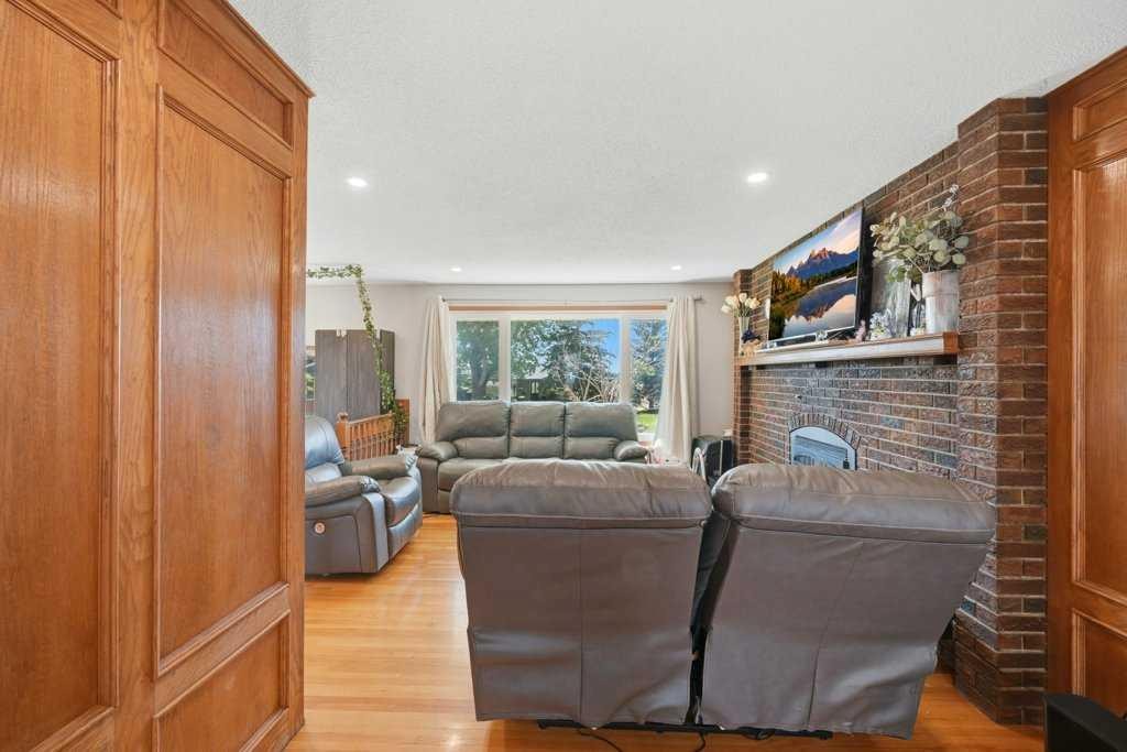 2415 Vista Crescent Ne, Calgary, AB - Indoor Photo Showing Living Room With Fireplace