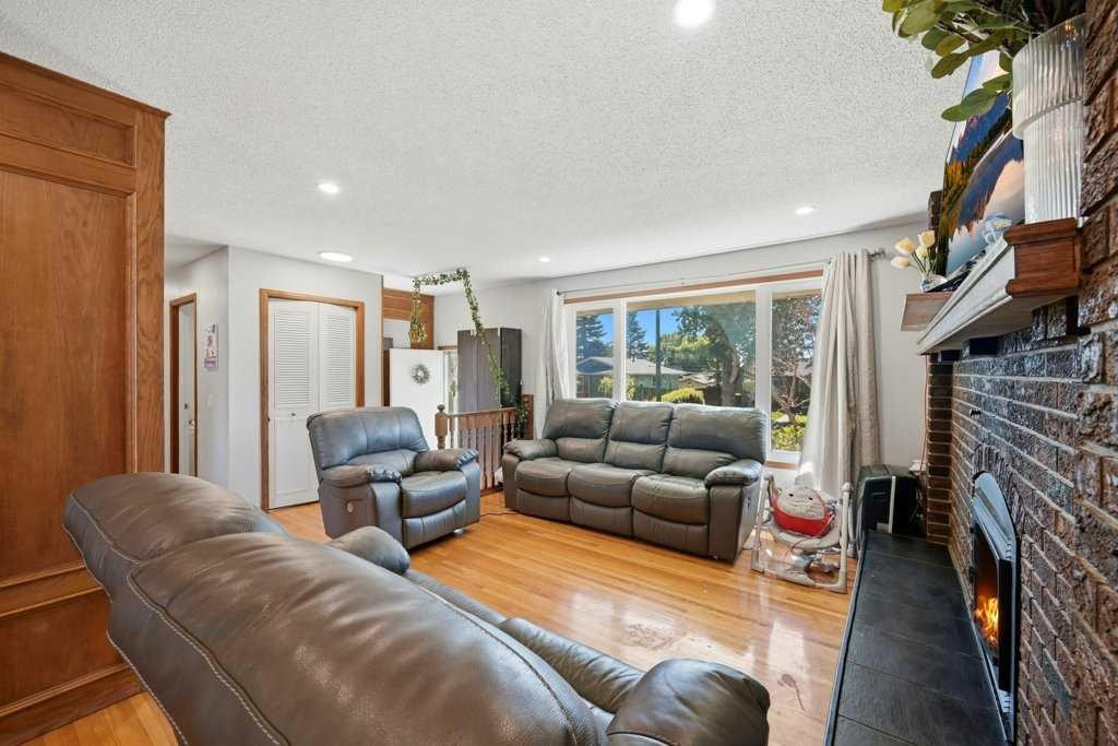 2415 Vista Crescent Ne, Calgary, AB - Indoor Photo Showing Living Room With Fireplace