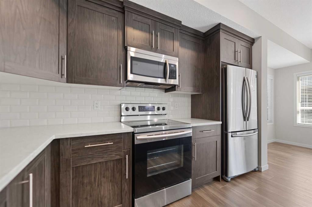 209 Harvest Hills Common Ne, Calgary, AB - Indoor Photo Showing Kitchen With Stainless Steel Kitchen