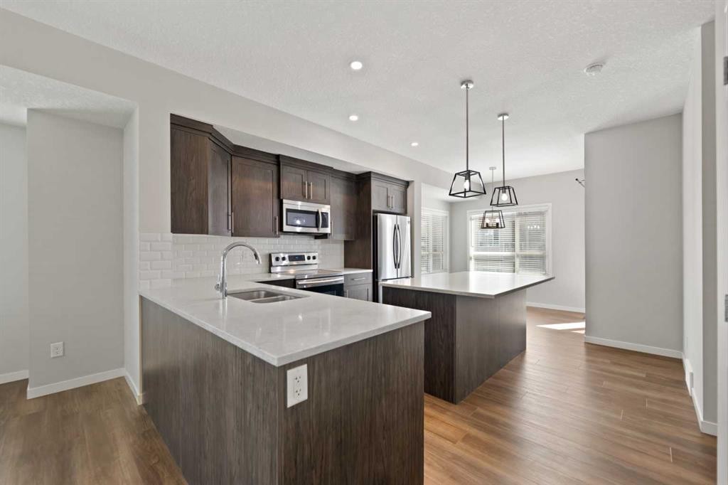 209 Harvest Hills Common Ne, Calgary, AB - Indoor Photo Showing Kitchen With Stainless Steel Kitchen With Double Sink With Upgraded Kitchen