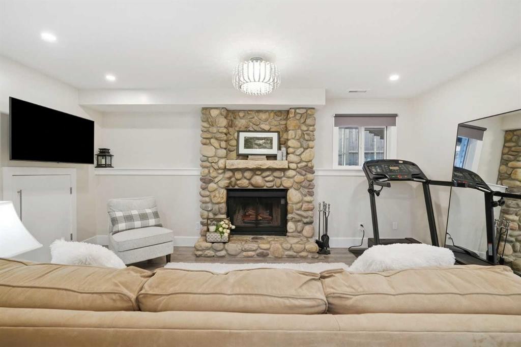 19 Millcrest Way Sw, Calgary, AB - Indoor Photo Showing Other Room With Fireplace