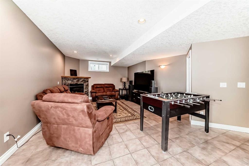 146 Scenic View Close, Calgary, AB - Indoor Photo Showing Other Room With Fireplace