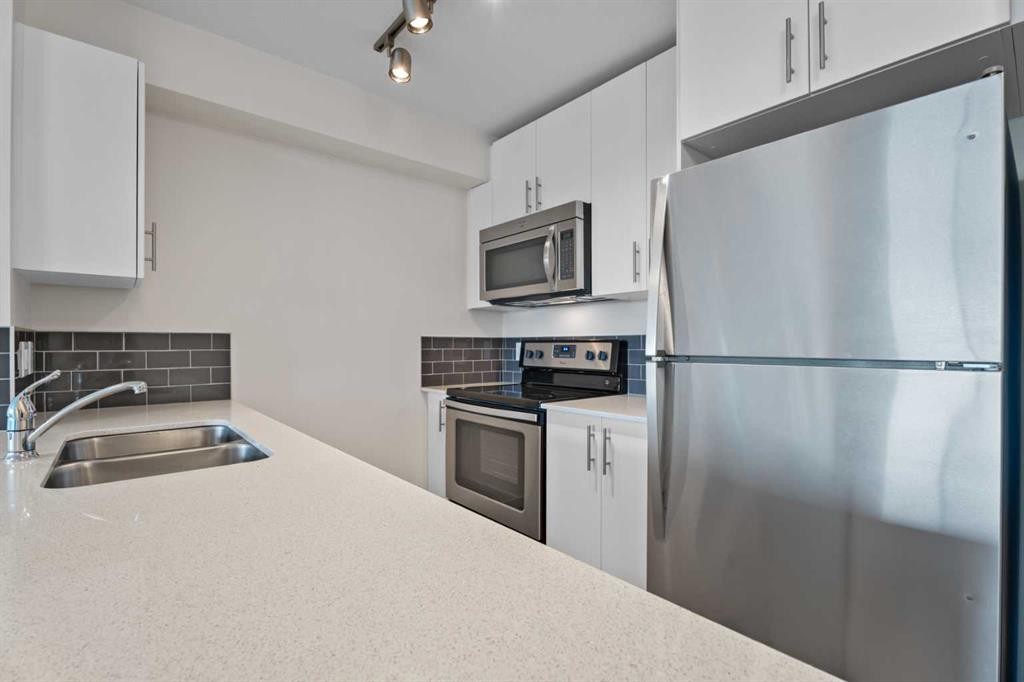2404-181 Skyview Ranch Manor Ne, Calgary, AB - Indoor Photo Showing Kitchen With Stainless Steel Kitchen With Double Sink