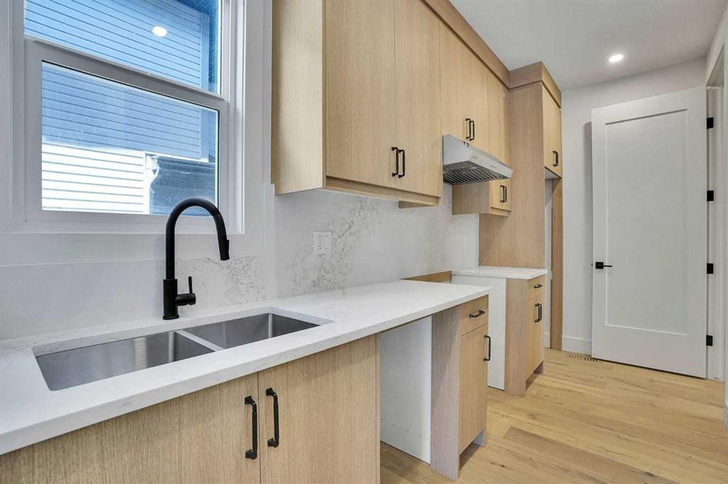287 Waterford Road, Chestermere, AB - Indoor Photo Showing Kitchen With Double Sink
