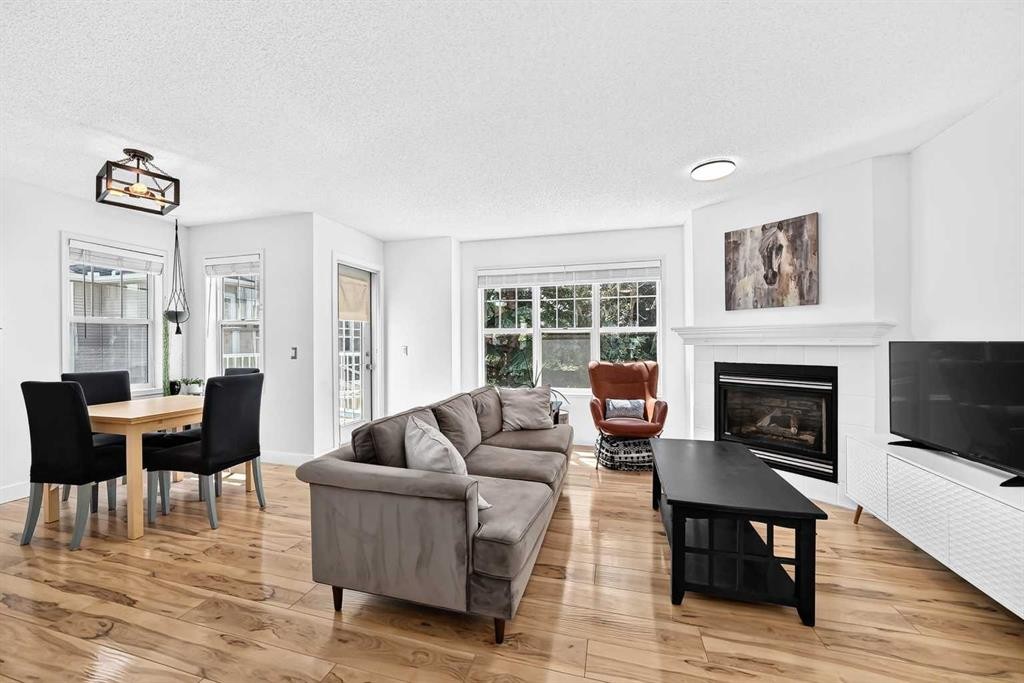 2906-7171 Coach Hill Road Sw, Calgary, AB - Indoor Photo Showing Living Room With Fireplace