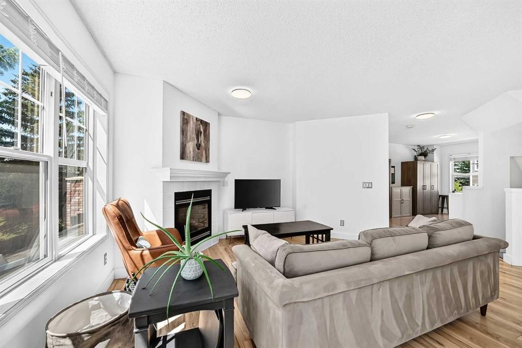 2906-7171 Coach Hill Road Sw, Calgary, AB - Indoor Photo Showing Living Room With Fireplace