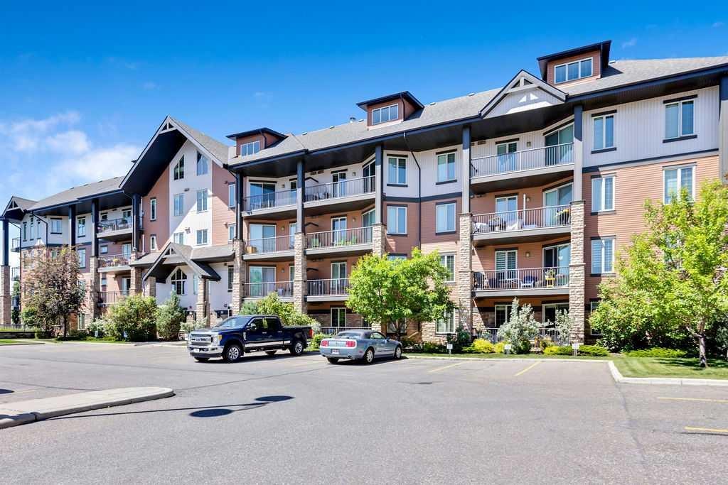 2110-15 Sunset Square, Cochrane, AB - Outdoor With Facade