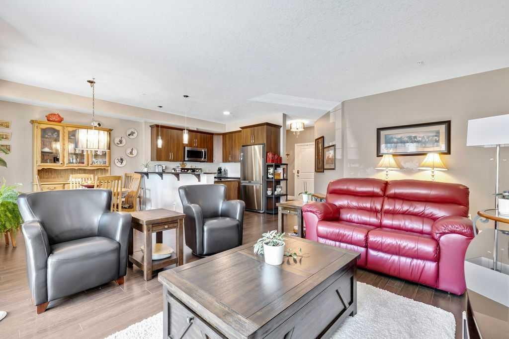 2110-15 Sunset Square, Cochrane, AB - Indoor Photo Showing Living Room