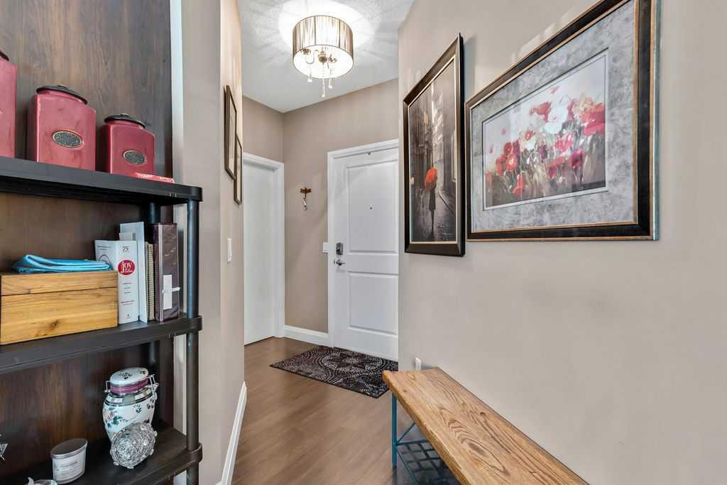 2110-15 Sunset Square, Cochrane, AB - Indoor Photo Showing Other Room