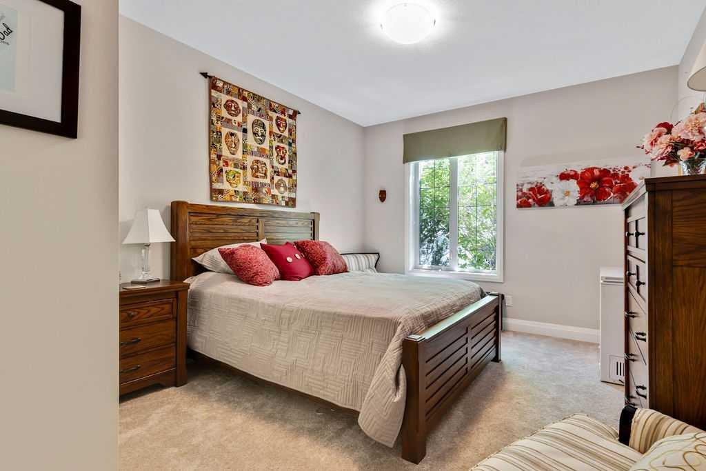 2110-15 Sunset Square, Cochrane, AB - Indoor Photo Showing Bedroom