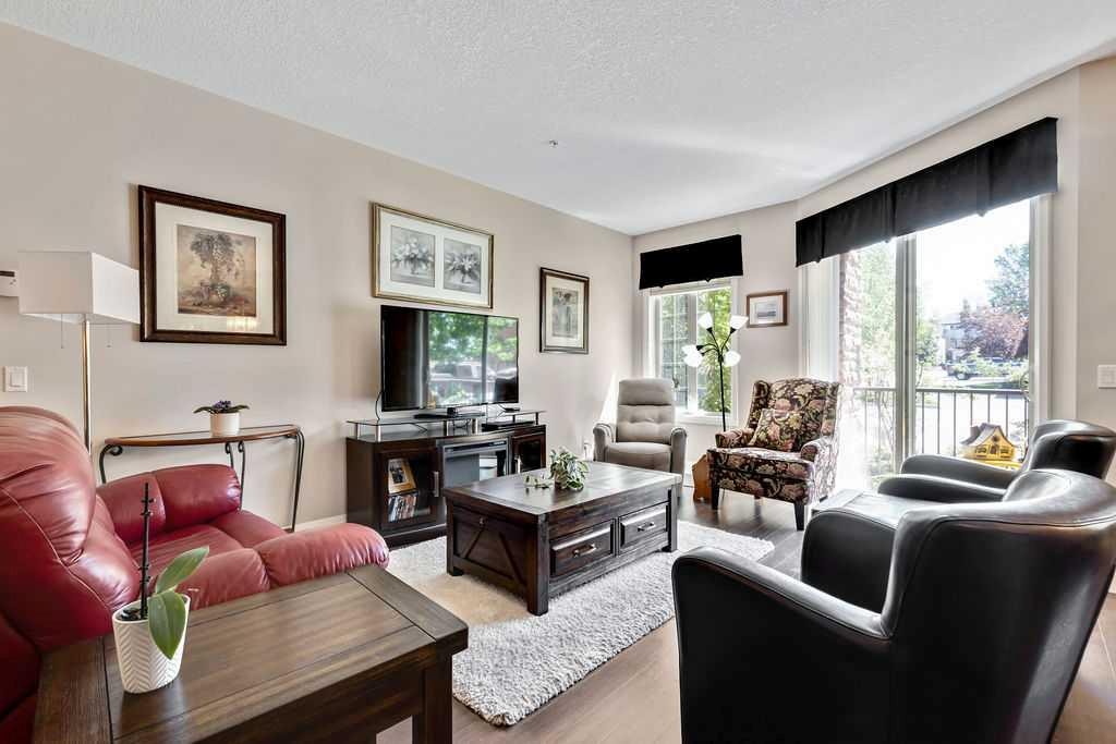 2110-15 Sunset Square, Cochrane, AB - Indoor Photo Showing Living Room