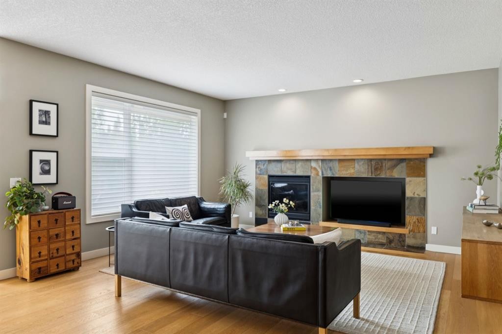 92 Discovery Ridge Circle Sw, Calgary, AB - Indoor Photo Showing Living Room With Fireplace