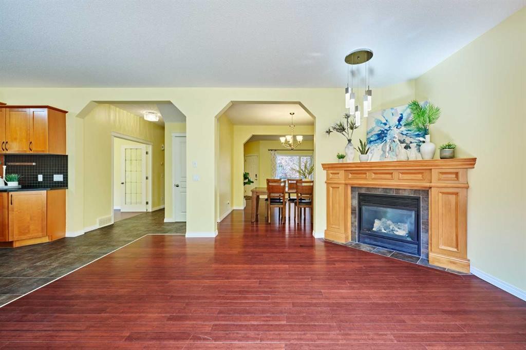 62 Crestmont Drive Sw, Calgary, AB - Indoor Photo Showing Living Room With Fireplace