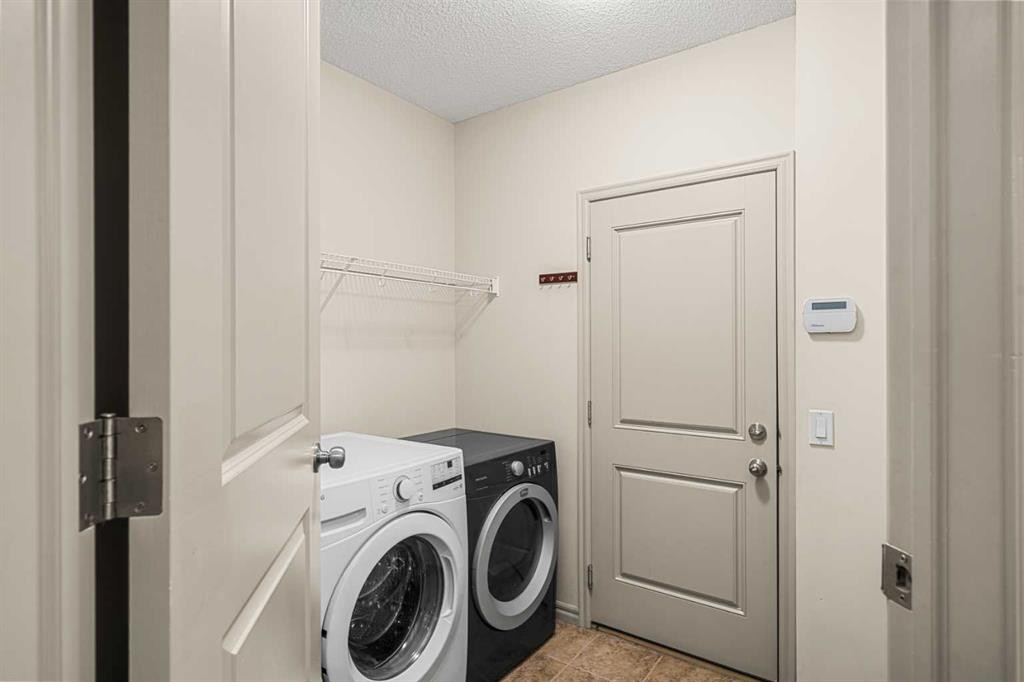 277 Brightonwoods Gardens Se, Calgary, AB - Indoor Photo Showing Laundry Room