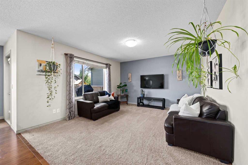 277 Brightonwoods Gardens Se, Calgary, AB - Indoor Photo Showing Living Room With Fireplace