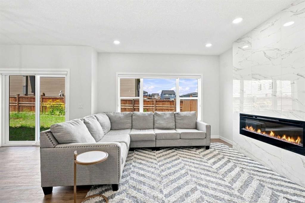 26 Homestead Circle Ne, Calgary, AB - Indoor Photo Showing Living Room With Fireplace