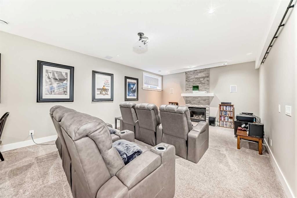 120 Kinniburgh Circle, Chestermere, AB - Indoor Photo Showing Living Room With Fireplace