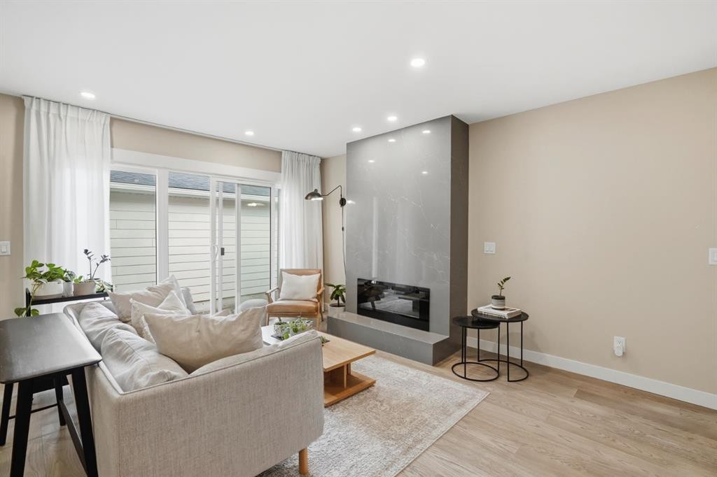 2924 Lathom Crescent Sw, Calgary, AB - Indoor Photo Showing Other Room With Fireplace
