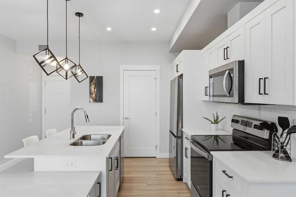 220-400 Auburn Meadows Common Se, Calgary, AB - Indoor Photo Showing Kitchen With Double Sink With Upgraded Kitchen