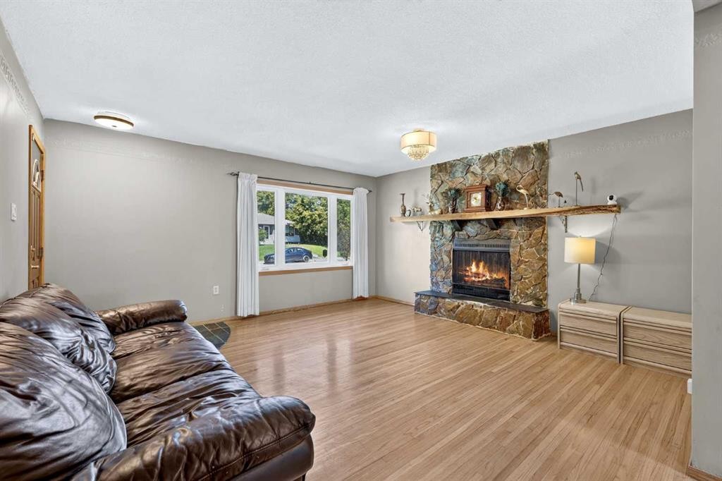 2018 Cottonwood Crescent Se, Calgary, AB - Indoor Photo Showing Living Room With Fireplace