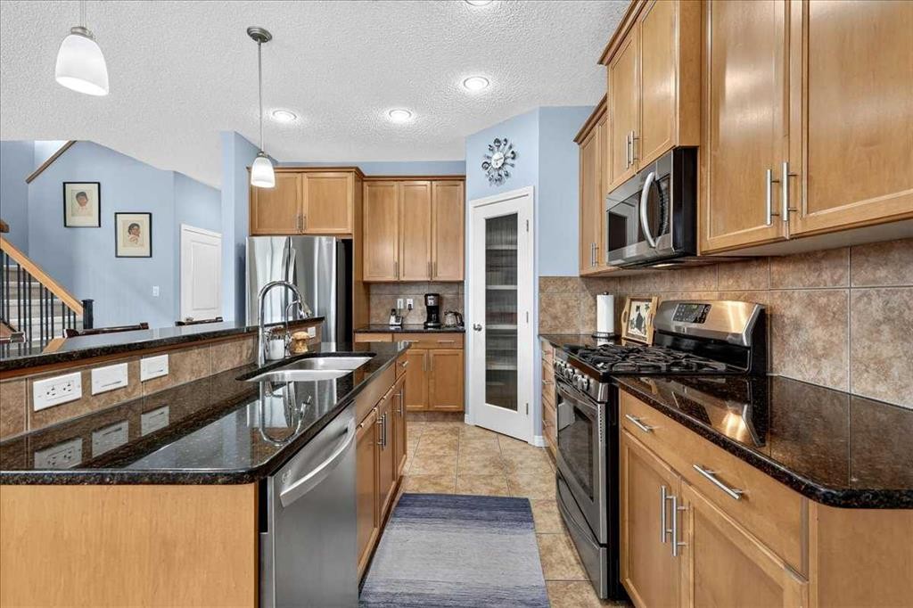 18 Copperstone Drive Se, Calgary, AB - Indoor Photo Showing Kitchen With Stainless Steel Kitchen With Double Sink With Upgraded Kitchen