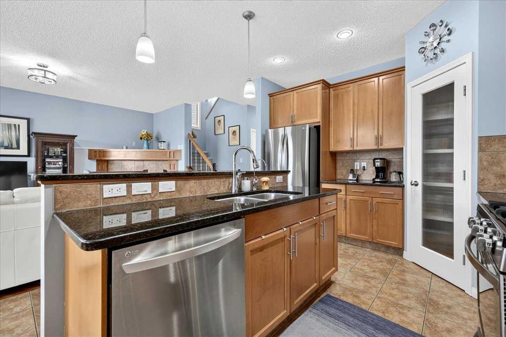 18 Copperstone Drive Se, Calgary, AB - Indoor Photo Showing Kitchen With Stainless Steel Kitchen With Double Sink