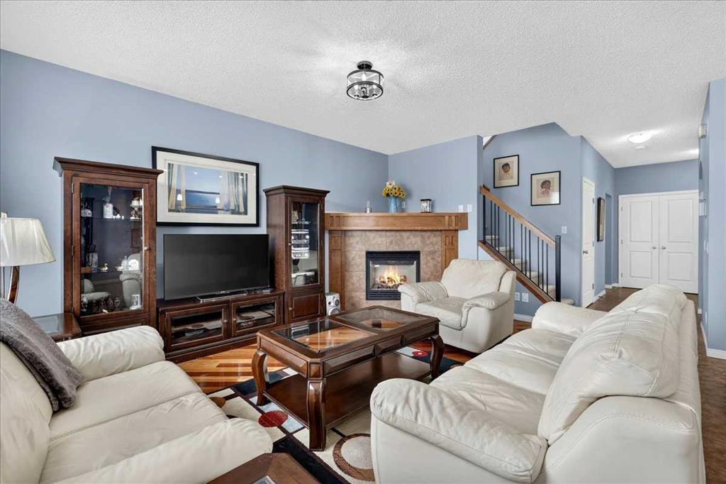 18 Copperstone Drive Se, Calgary, AB - Indoor Photo Showing Living Room With Fireplace