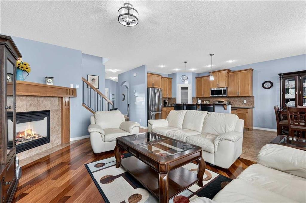 18 Copperstone Drive Se, Calgary, AB - Indoor Photo Showing Living Room With Fireplace