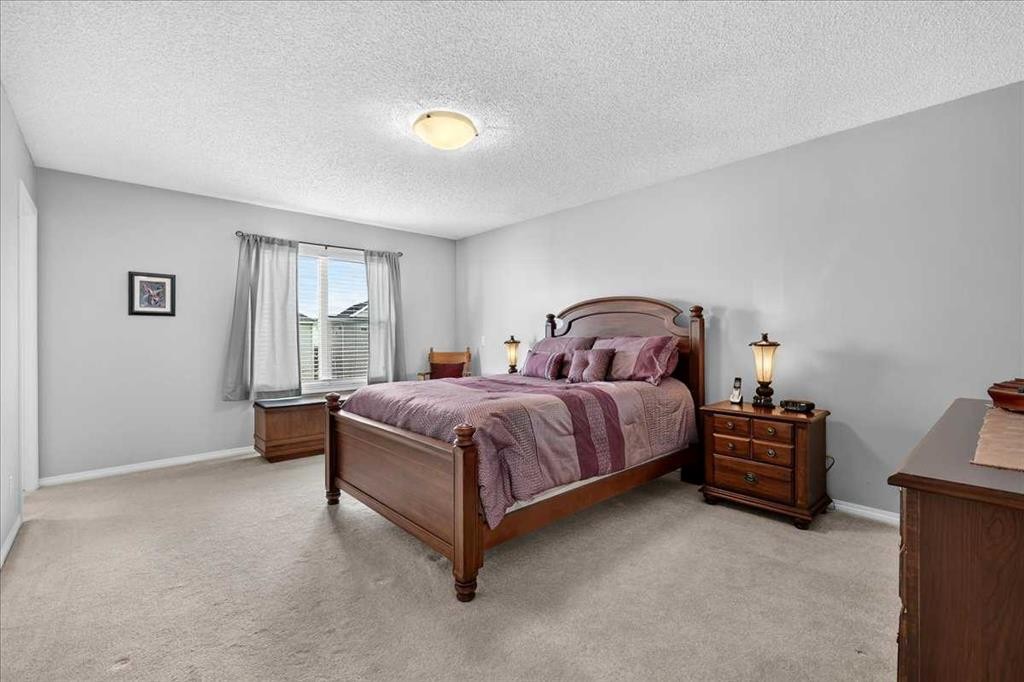 18 Copperstone Drive Se, Calgary, AB - Indoor Photo Showing Bedroom