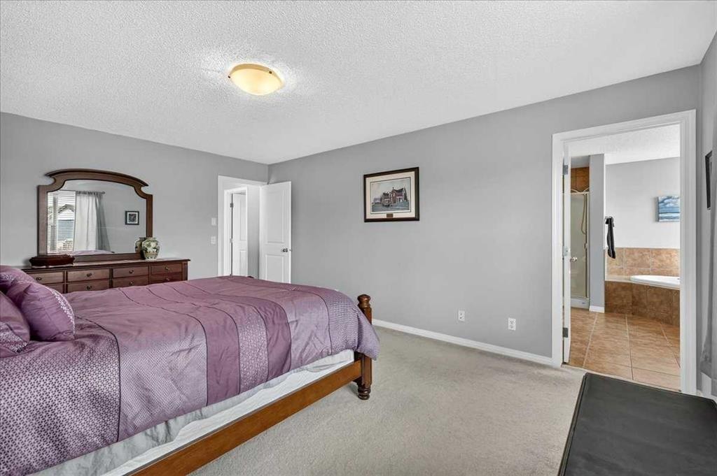 18 Copperstone Drive Se, Calgary, AB - Indoor Photo Showing Bedroom