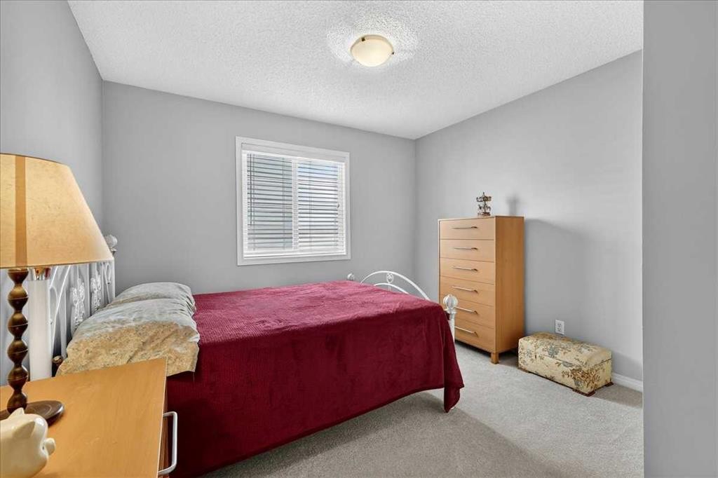 18 Copperstone Drive Se, Calgary, AB - Indoor Photo Showing Bedroom