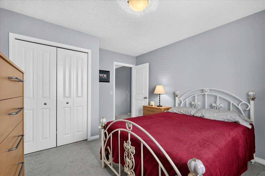 18 Copperstone Drive Se, Calgary, AB - Indoor Photo Showing Bedroom