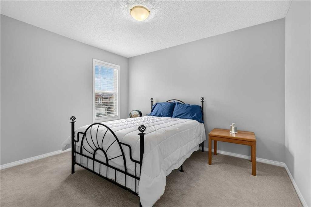 18 Copperstone Drive Se, Calgary, AB - Indoor Photo Showing Bedroom