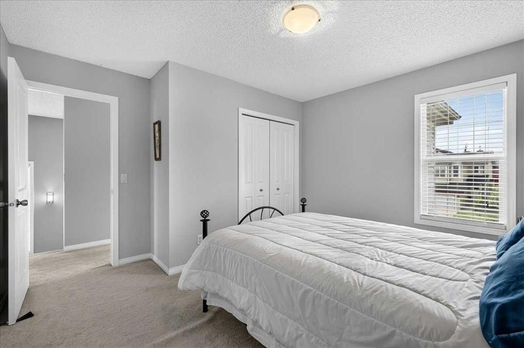 18 Copperstone Drive Se, Calgary, AB - Indoor Photo Showing Bedroom