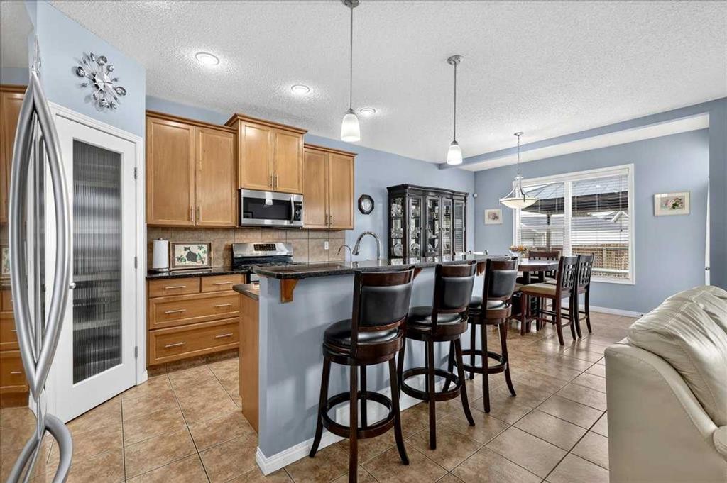 18 Copperstone Drive Se, Calgary, AB - Indoor Photo Showing Kitchen With Stainless Steel Kitchen With Upgraded Kitchen