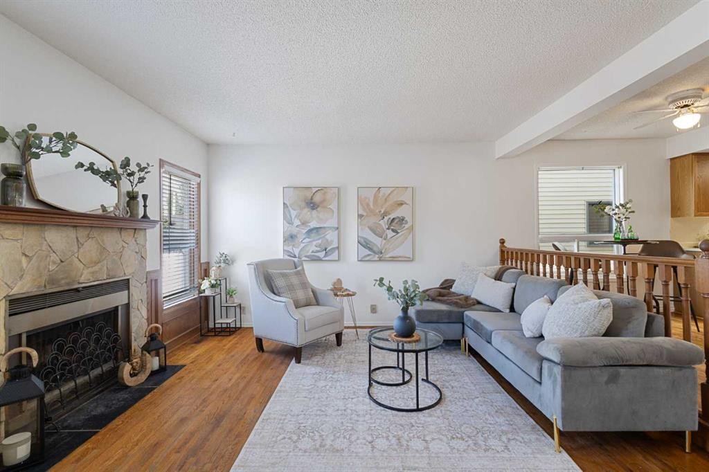 1132 Millcrest Rise Sw, Calgary, AB - Indoor Photo Showing Living Room With Fireplace
