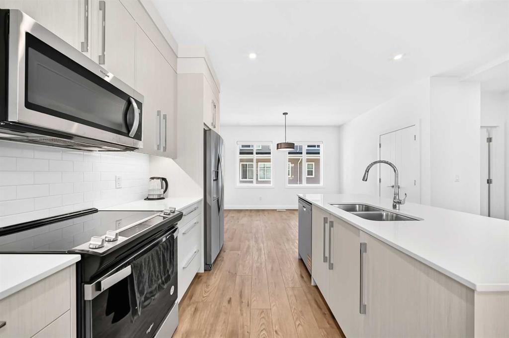 308-135 Belmont Passage Sw, Calgary, AB - Indoor Photo Showing Kitchen With Double Sink With Upgraded Kitchen