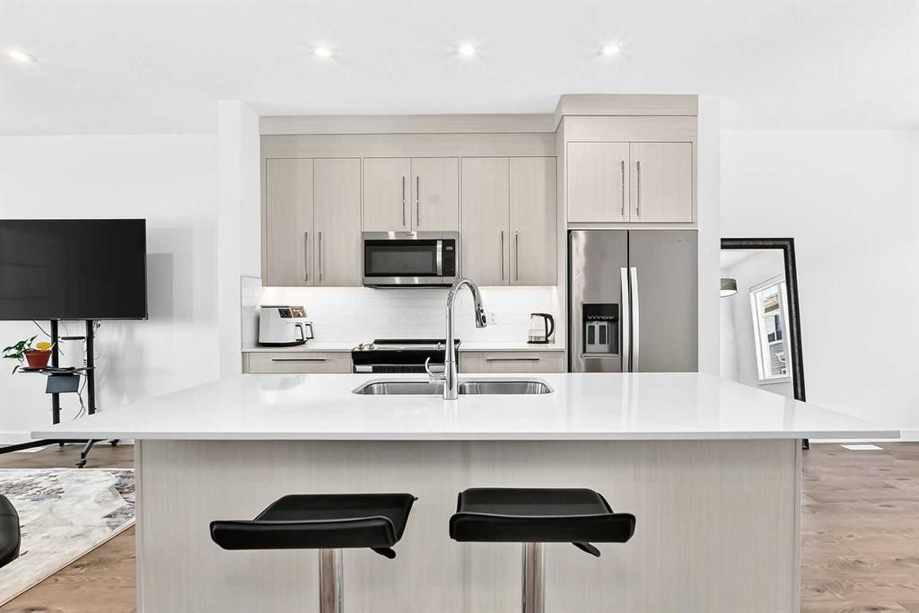 308-135 Belmont Passage Sw, Calgary, AB - Indoor Photo Showing Kitchen With Stainless Steel Kitchen With Double Sink With Upgraded Kitchen