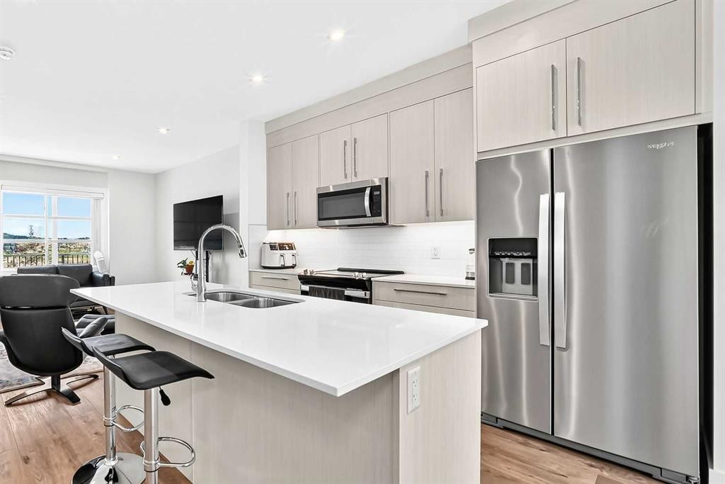 308-135 Belmont Passage Sw, Calgary, AB - Indoor Photo Showing Kitchen With Stainless Steel Kitchen With Double Sink With Upgraded Kitchen