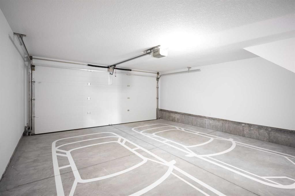 86 Heirloom Passage Se, Calgary, AB - Indoor Photo Showing Garage