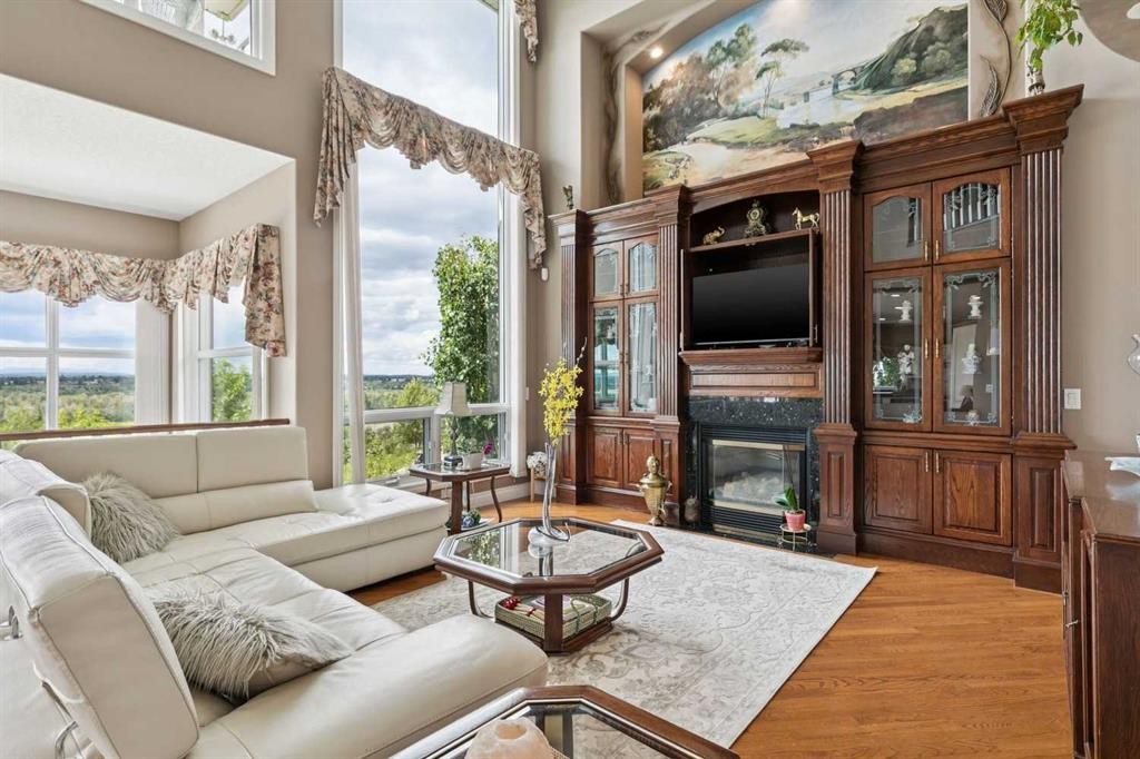 85 Mt Douglas Circle Se, Calgary, AB - Indoor Photo Showing Living Room With Fireplace