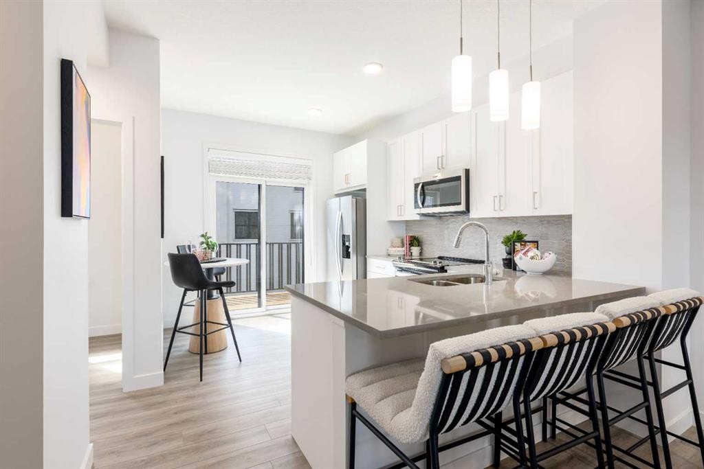 90 Heirloom Passage Se, Calgary, AB - Indoor Photo Showing Kitchen With Double Sink With Upgraded Kitchen