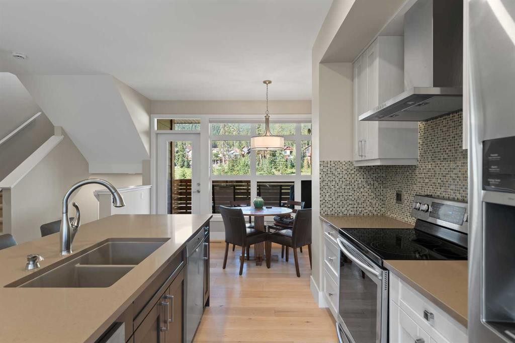 407 Riva Place, Canmore, AB - Indoor Photo Showing Kitchen With Double Sink With Upgraded Kitchen
