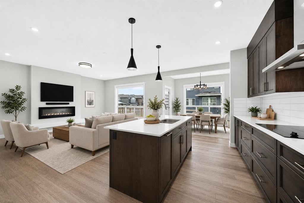 137 Creekside Way Sw, Calgary, AB - Indoor Photo Showing Kitchen With Fireplace With Upgraded Kitchen