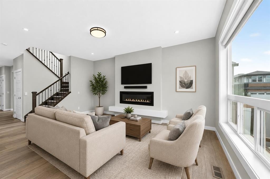 137 Creekside Way Sw, Calgary, AB - Indoor Photo Showing Living Room With Fireplace